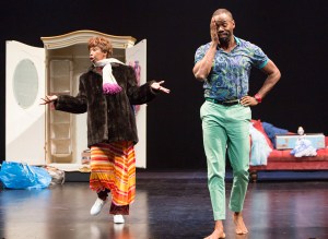 Aunt Glo (Sharon Washington) cleans out the closet of her deceased sister Adelaide, much to the chagrin of Adelaide's son Gil (Colman Domingo) in the TheatreWorks Silicon Valley production of "Wild With Happy." (Photo by Mark Kitaoka)