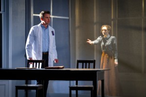 Brian (Ross Lekites) is driven by the secrets of those who worked in the building he now occupies, sharing a moment with Sarah (Megan McGinnis) in "Triangle" at TheatreWorks. (Photo by Kevin Berne)